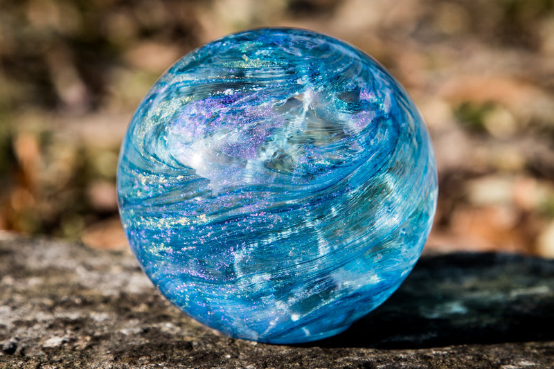 sky blue glass orb with cremation ash